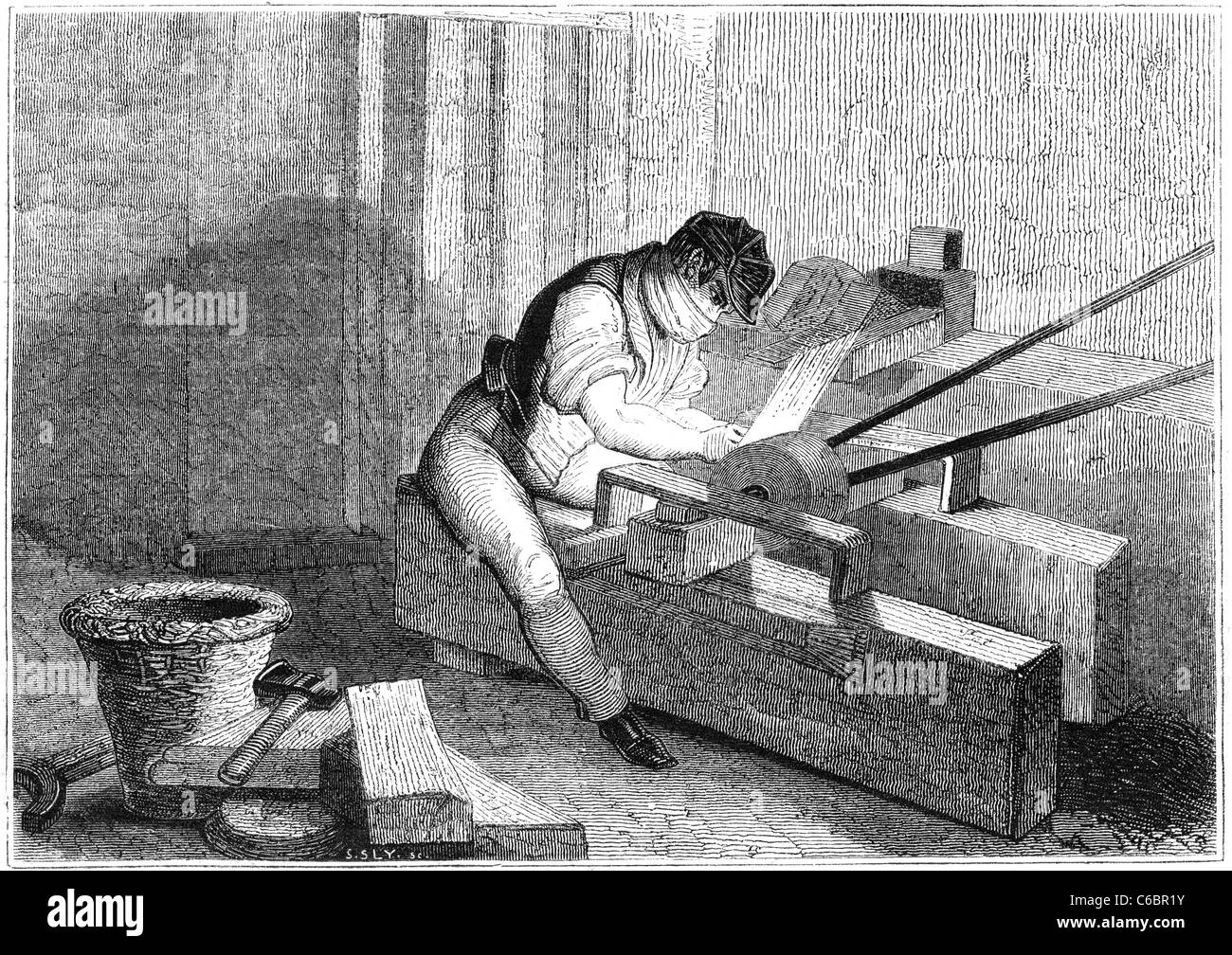 A Day at the british needle-mills, Redditch: Needle-pointer at work. Illustration from a british magazine printed in 1843. Stock Photo