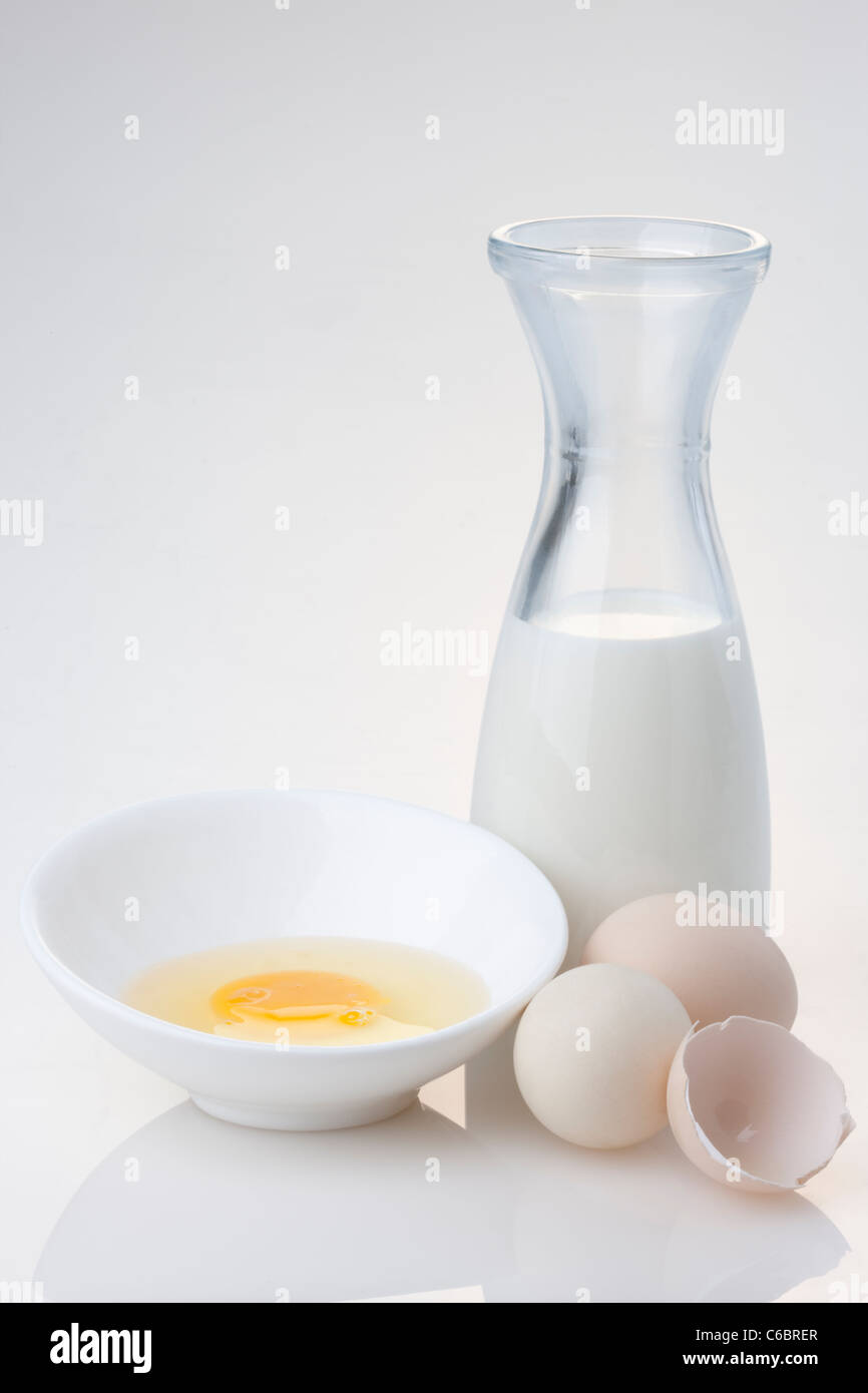 Cracked Raw Eggs and Milk Stock Photo Alamy