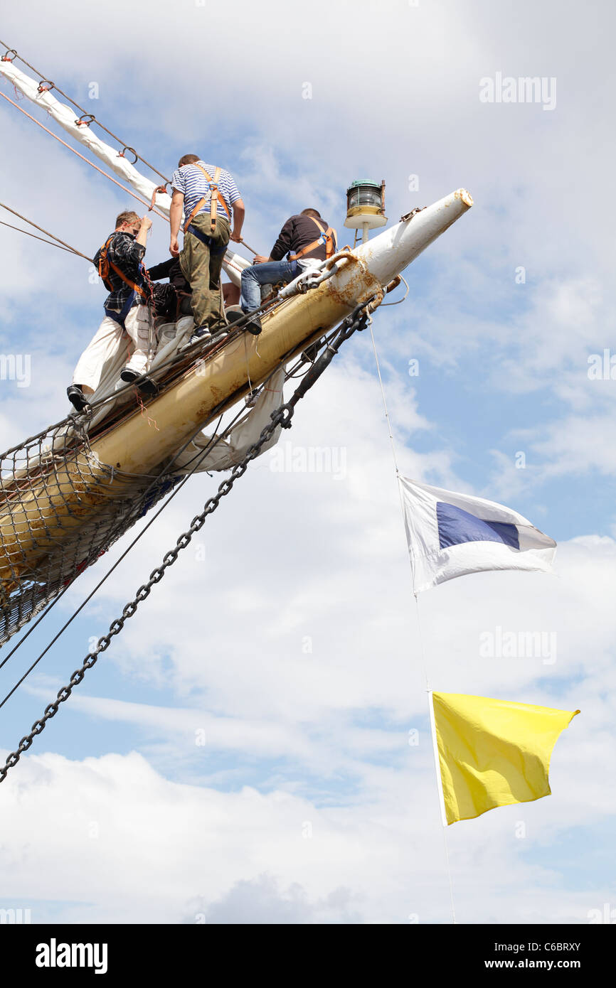 Tall Ships Race, crew members working on the bowsprit of a ship in the harbour, Greenock, Inverclyde, Scotland, UK Stock Photo