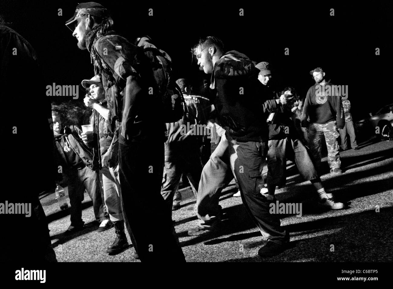 Young people dance during the night at Czech Free Tekno Festival “Czarotek” close to Květná, Czech Republic. Stock Photo