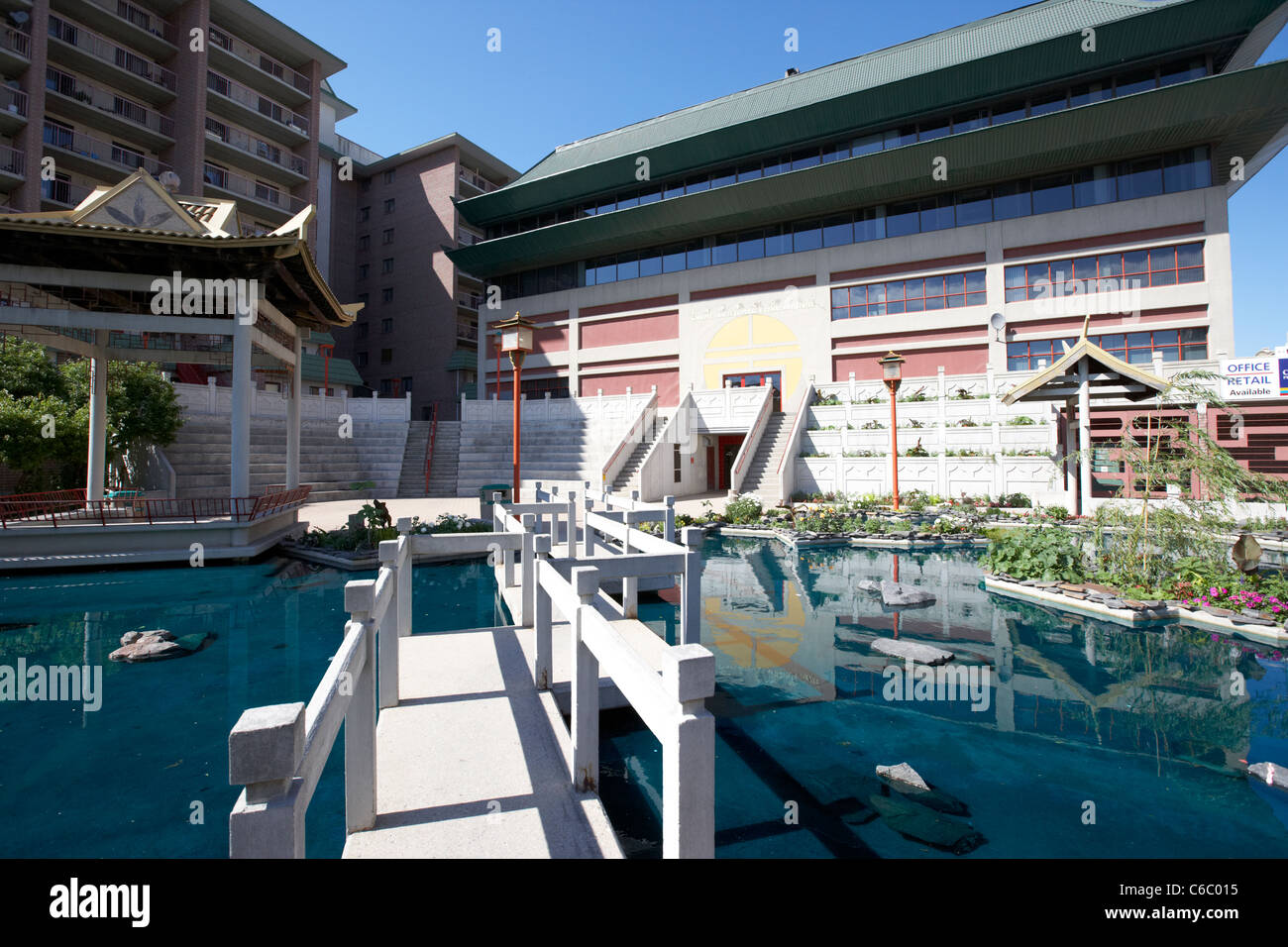 bridge over pond in ornate garden at chinese cultural centre in the