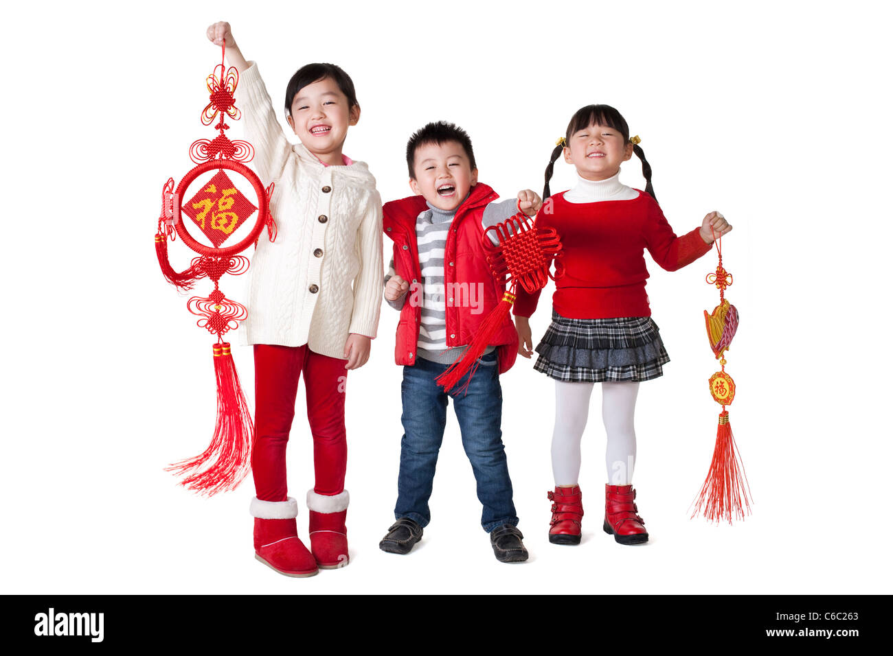 Chinese children holding traditional Chinese items Stock Photo