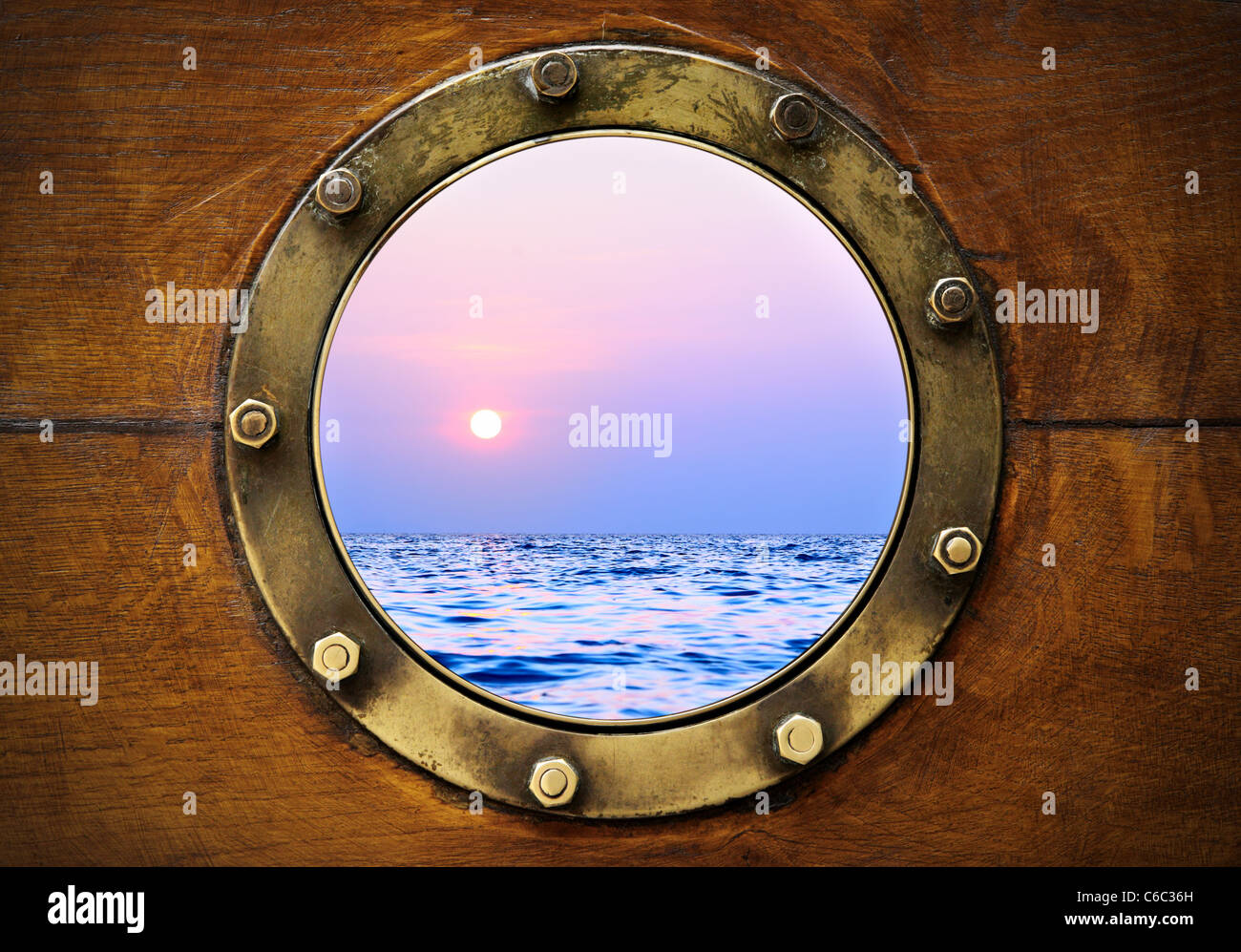 Boat porthole with ocean view close up Stock Photo