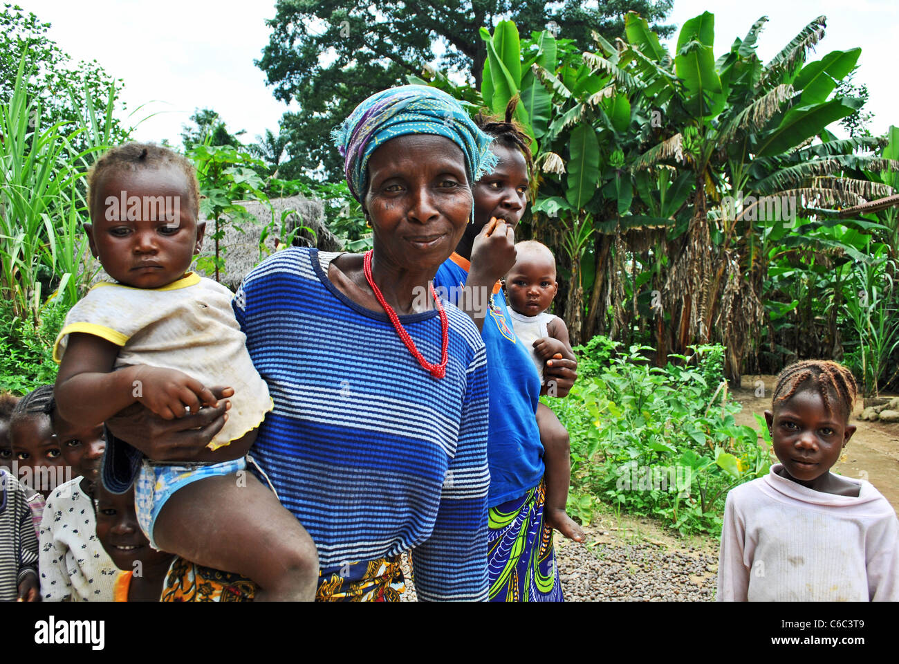 A grandmother and grandchildren in the village of Bolahun, Lofa County ...