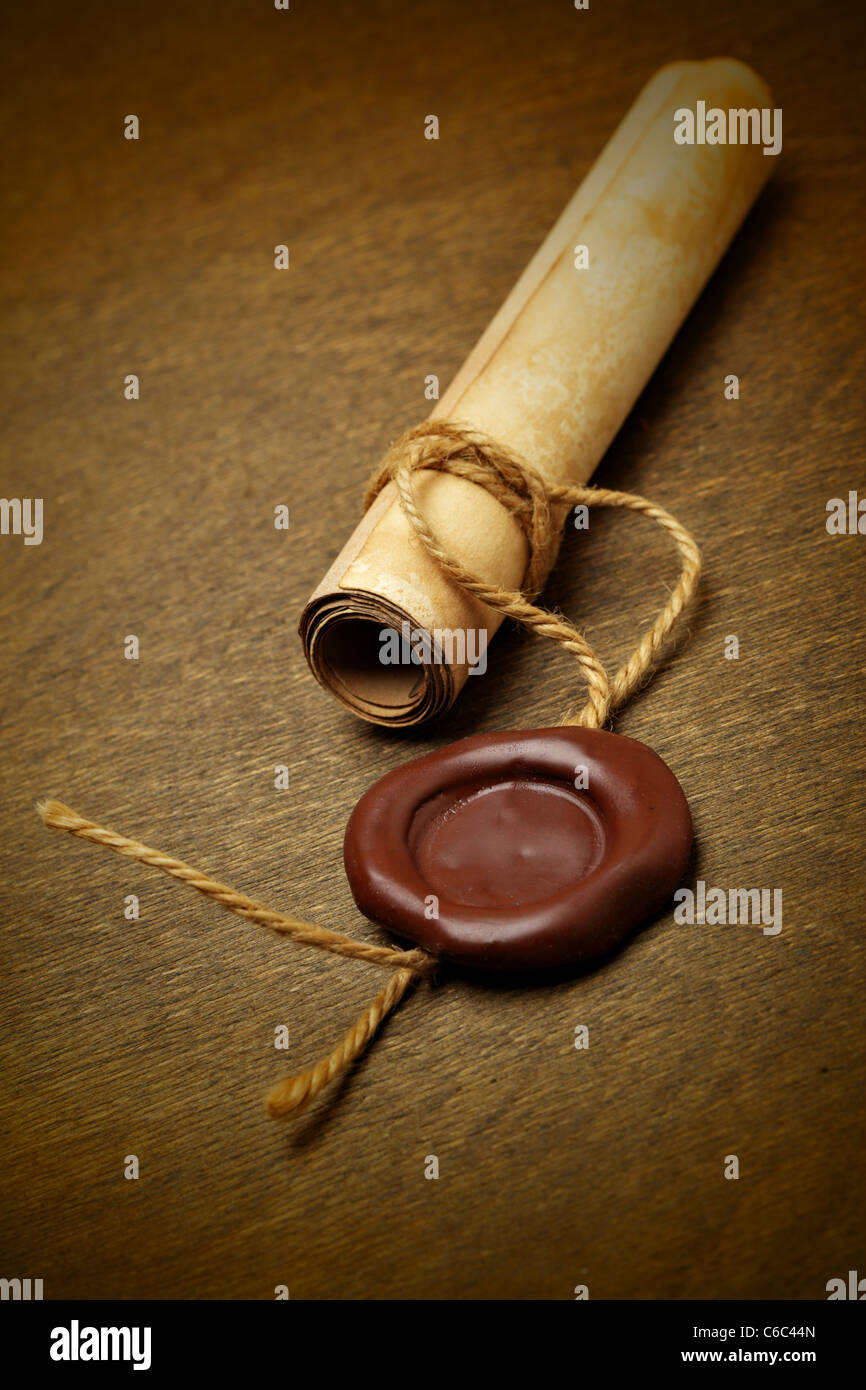Manuscript with wax seal on a wooden table Stock Photo