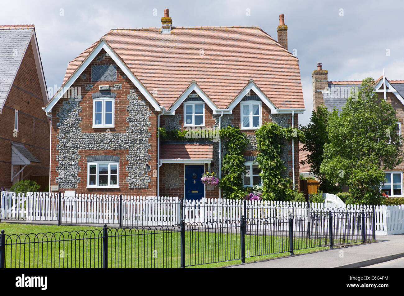 Modern house incorporating brick and flint stones in an ornamental way