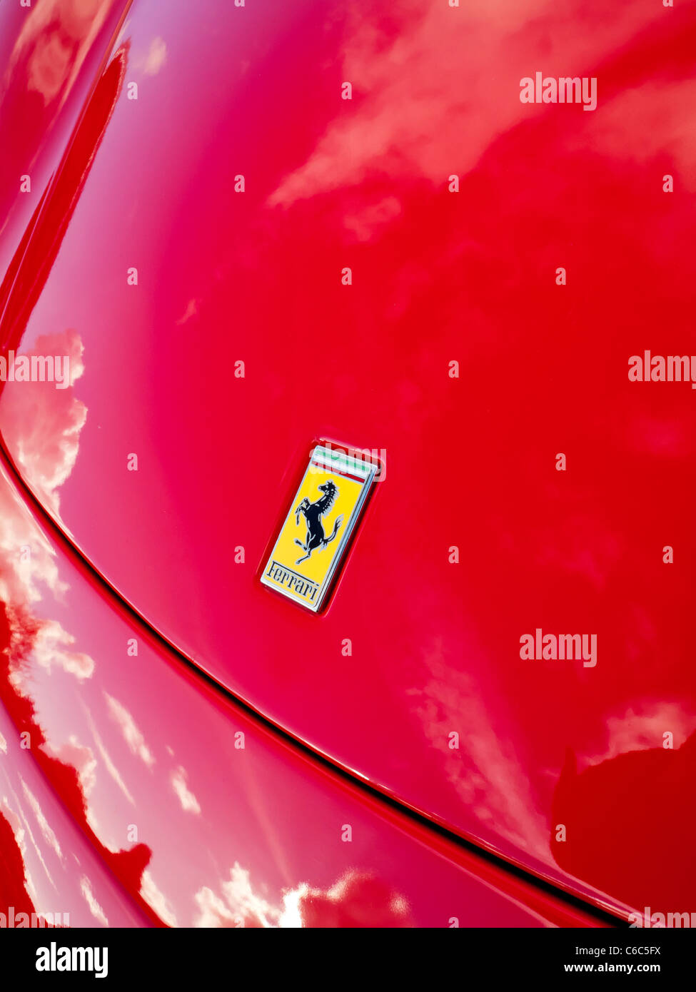 Bonnet of bright red Ferrari sports car with the company logo visible Stock Photo