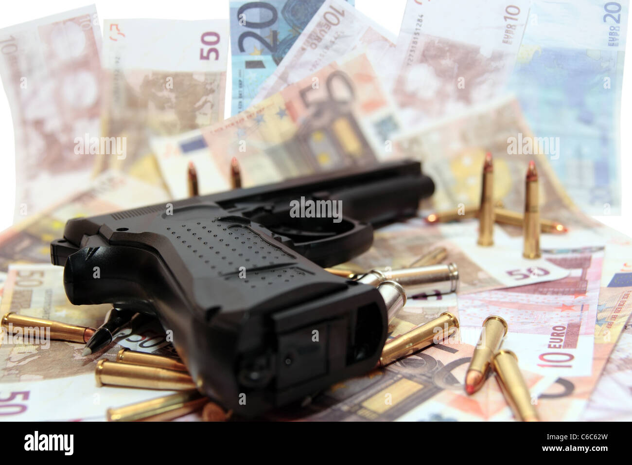 gun bullets and money showing a dangerous side to life Stock Photo Alamy