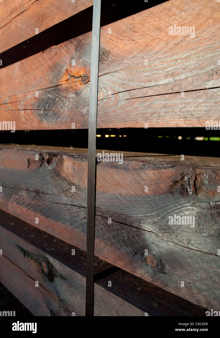 Brand new square wooden timber beams used as railroad cross ties / sleepers , Finland Stock Photo