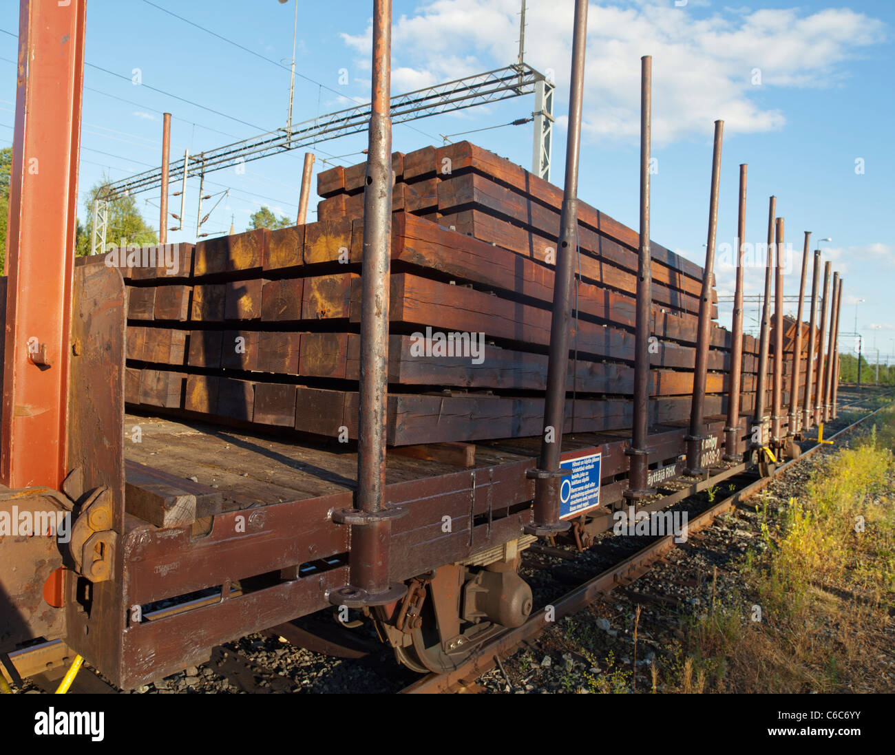 Trainload of brand new wooden railroad cross ties, Finland Stock Photo