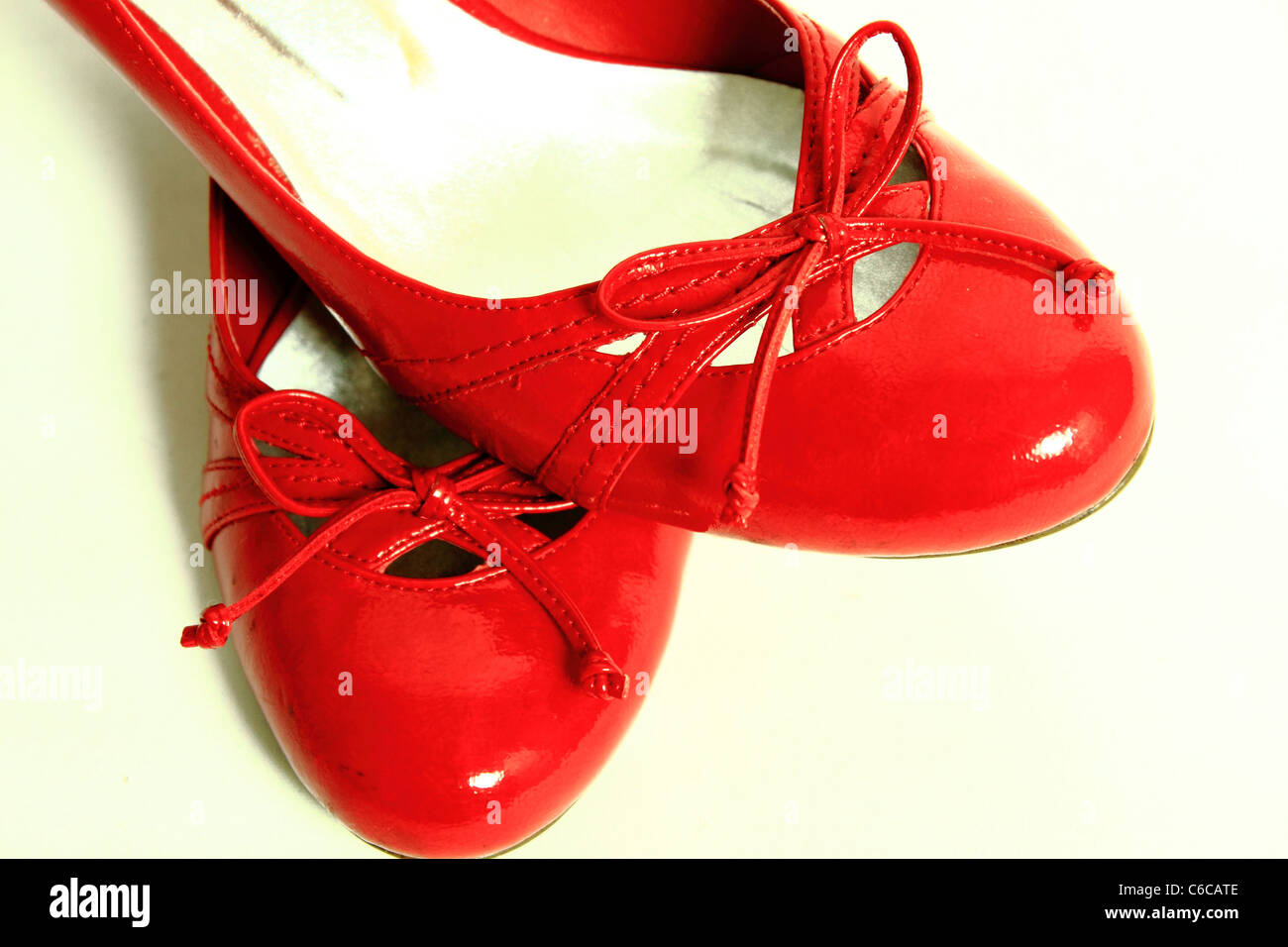 Red Shiny Shoes on a White Background Stock Photo - Alamy