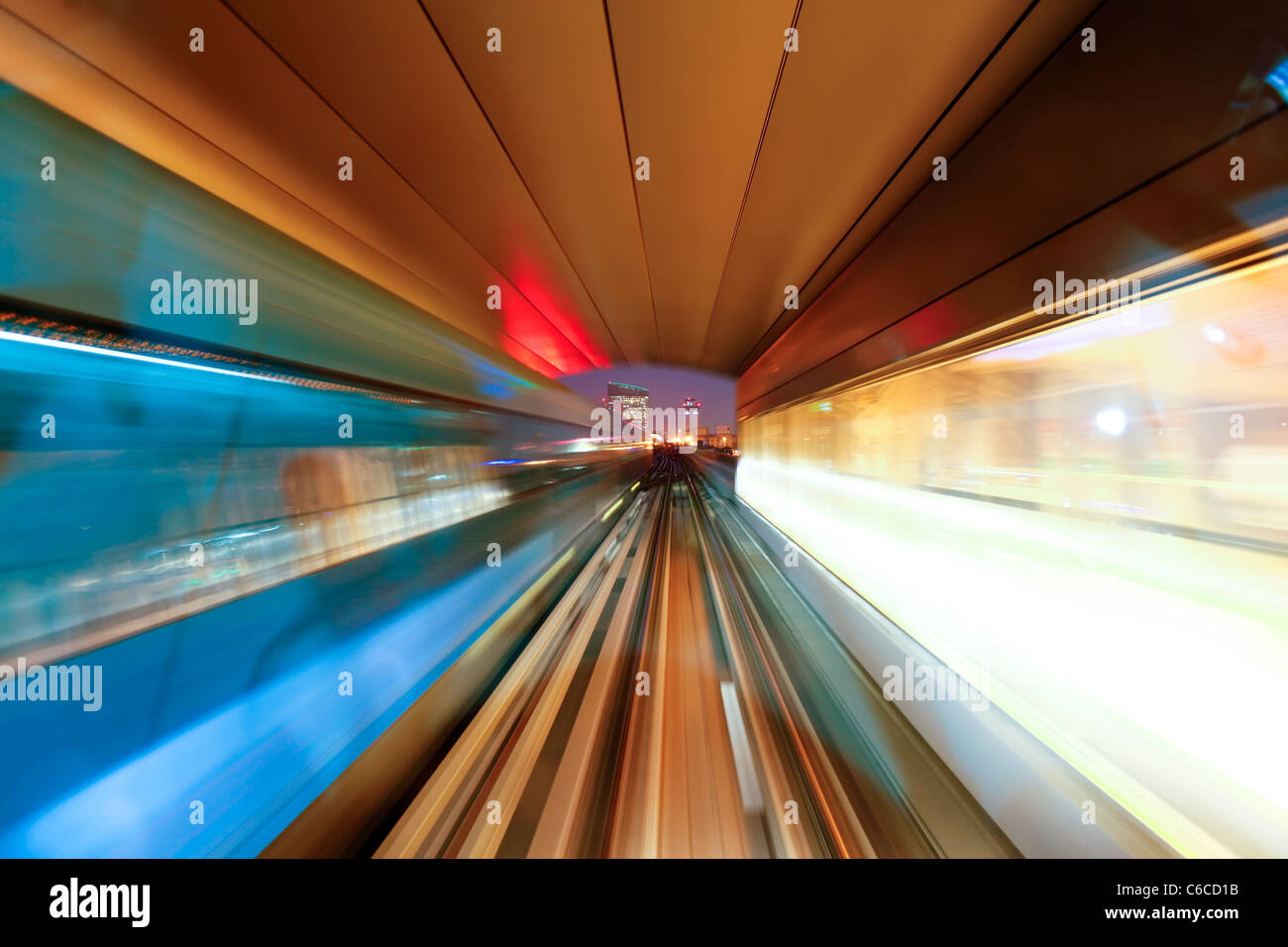 Opened in 2010, the Dubai Metro, MRT, in motion approaching a station, Dubai, United Arab Emirates Stock Photo