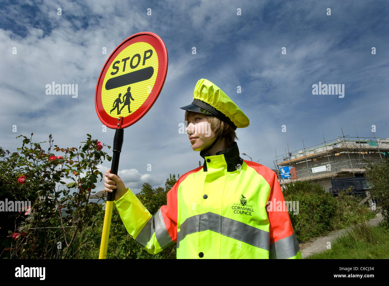 Cornwall's youngest lollipop lady in 2011, 18 year old Tomasina on school crossing patrol. Stock Photo