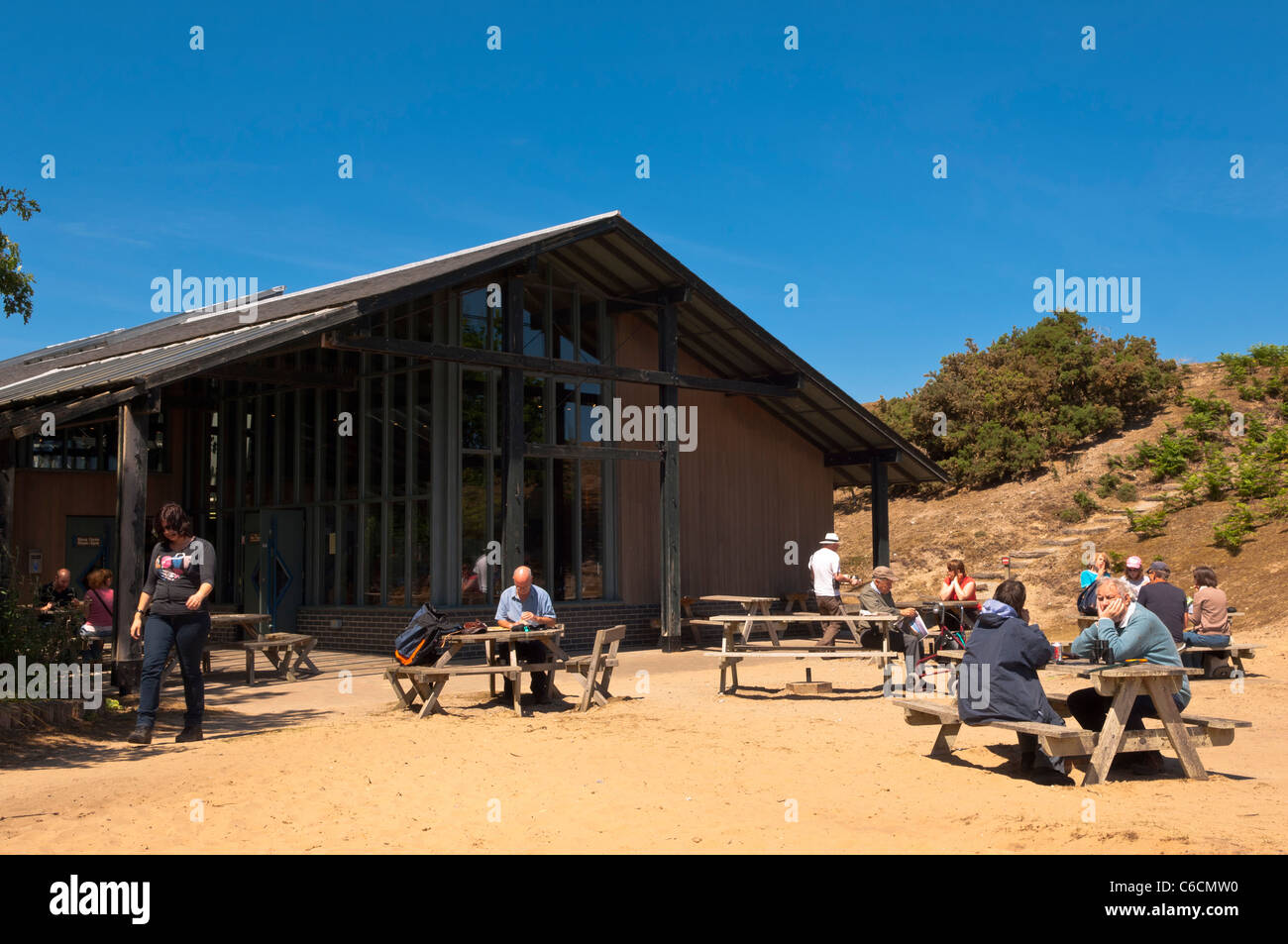 People sitting outside the cafe and visitor centre at Minsmere bird reserve , Suffolk , England , Britain , Uk Stock Photo