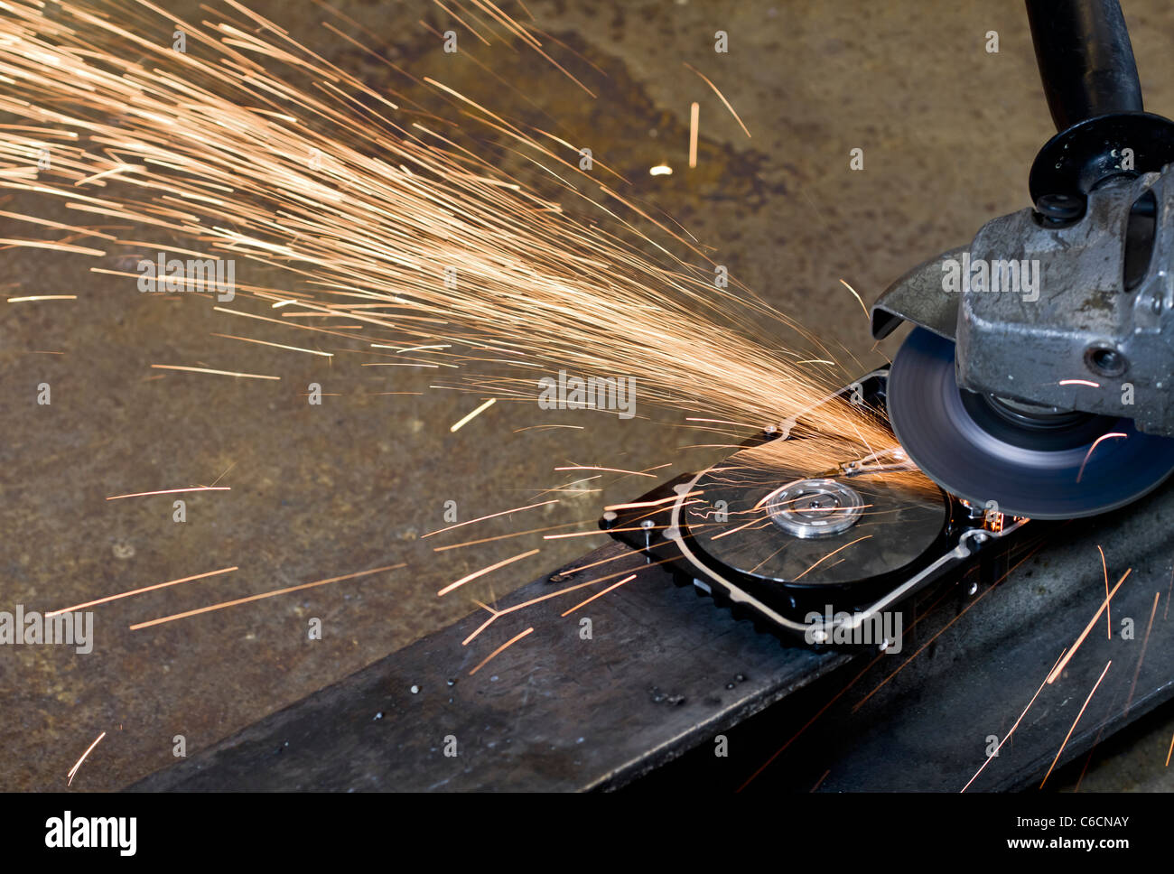 close up view, sparks flying away. rusty background Stock Photo
