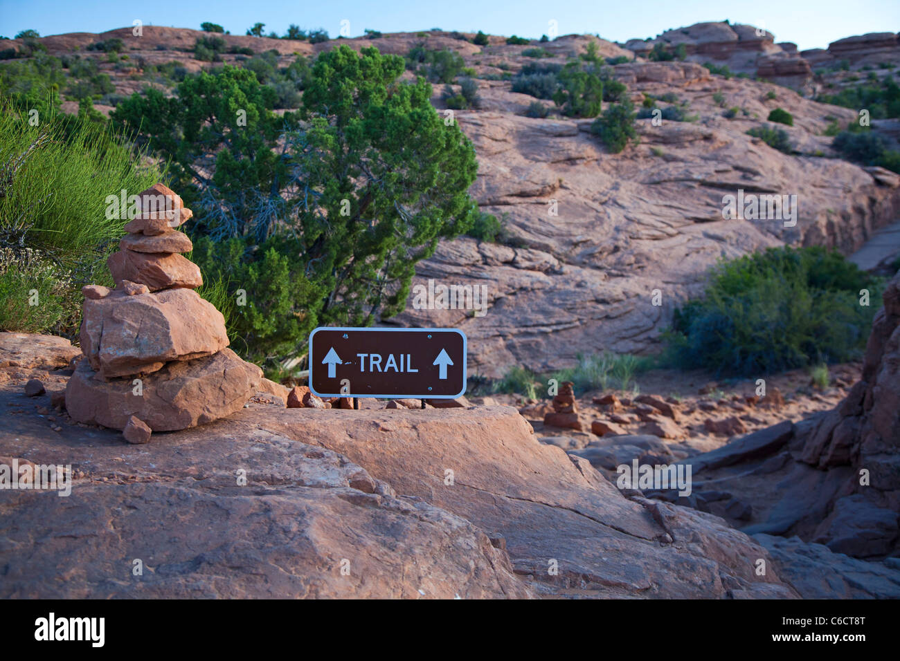 Moab, Utah - A cairn and a sign mark the trail to Delicate Arch in Arches National Park. Stock Photo