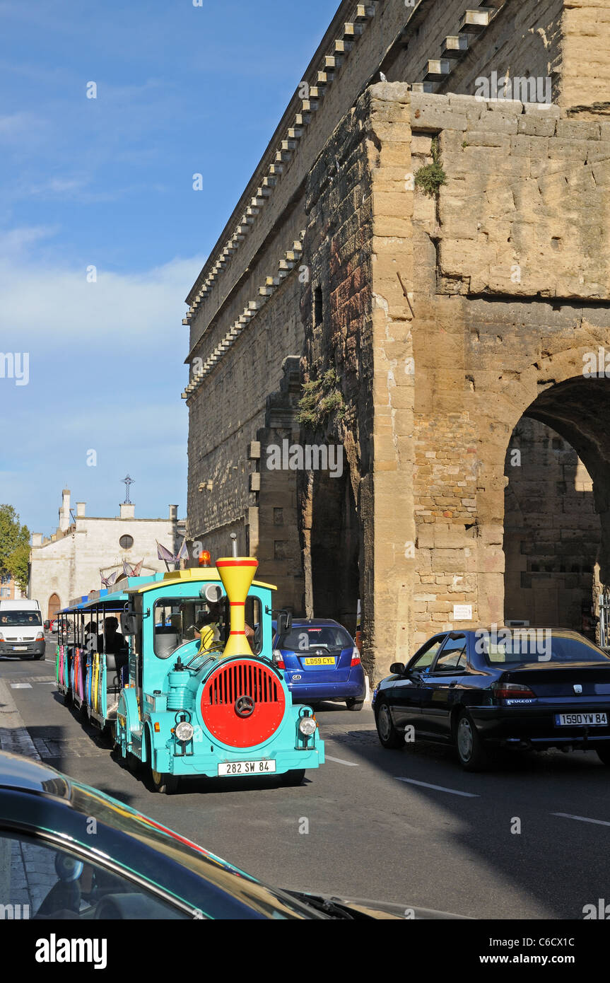 Tourist train passing Antique ancient old Roman Theatre on Rue Madeline Roch Orange Provence France Stock Photo