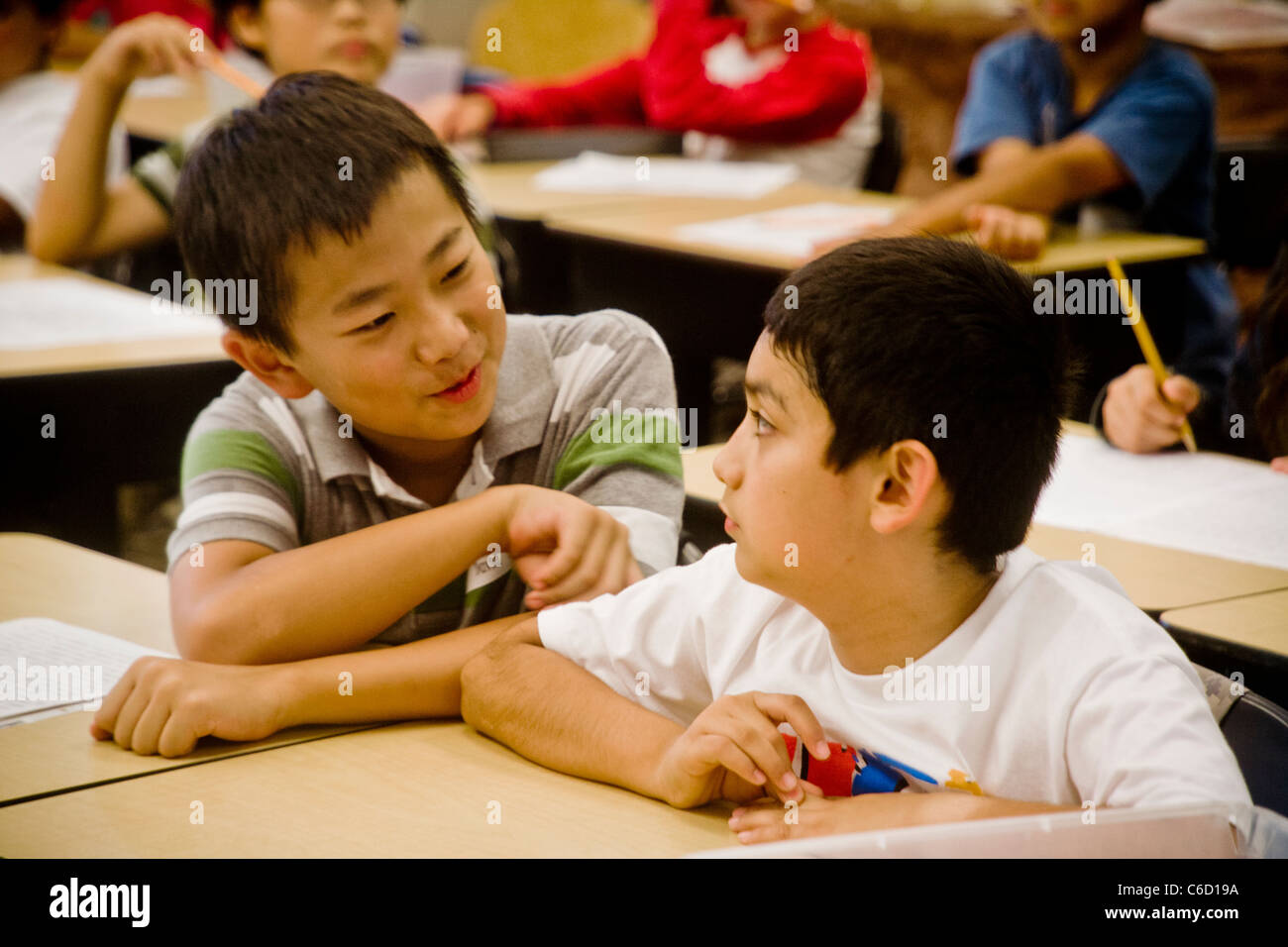 Hispanic and Asian American science students socialize in a summer learning program at the University of California at Irvine. Stock Photo