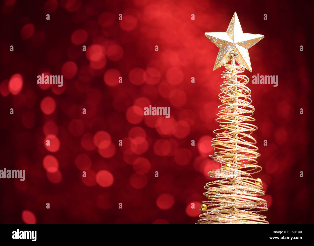 Golden christmas tree on abstract light background. Stock Photo
