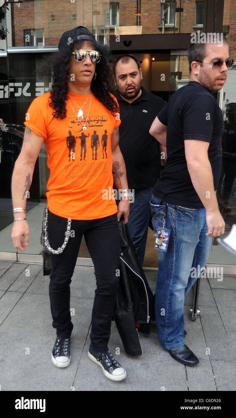 Former Guns N' Roses guitarist Slash signs autographs for fans as he leaves  the Morrison Hotel Dublin, Ireland  Stock Photo - Alamy