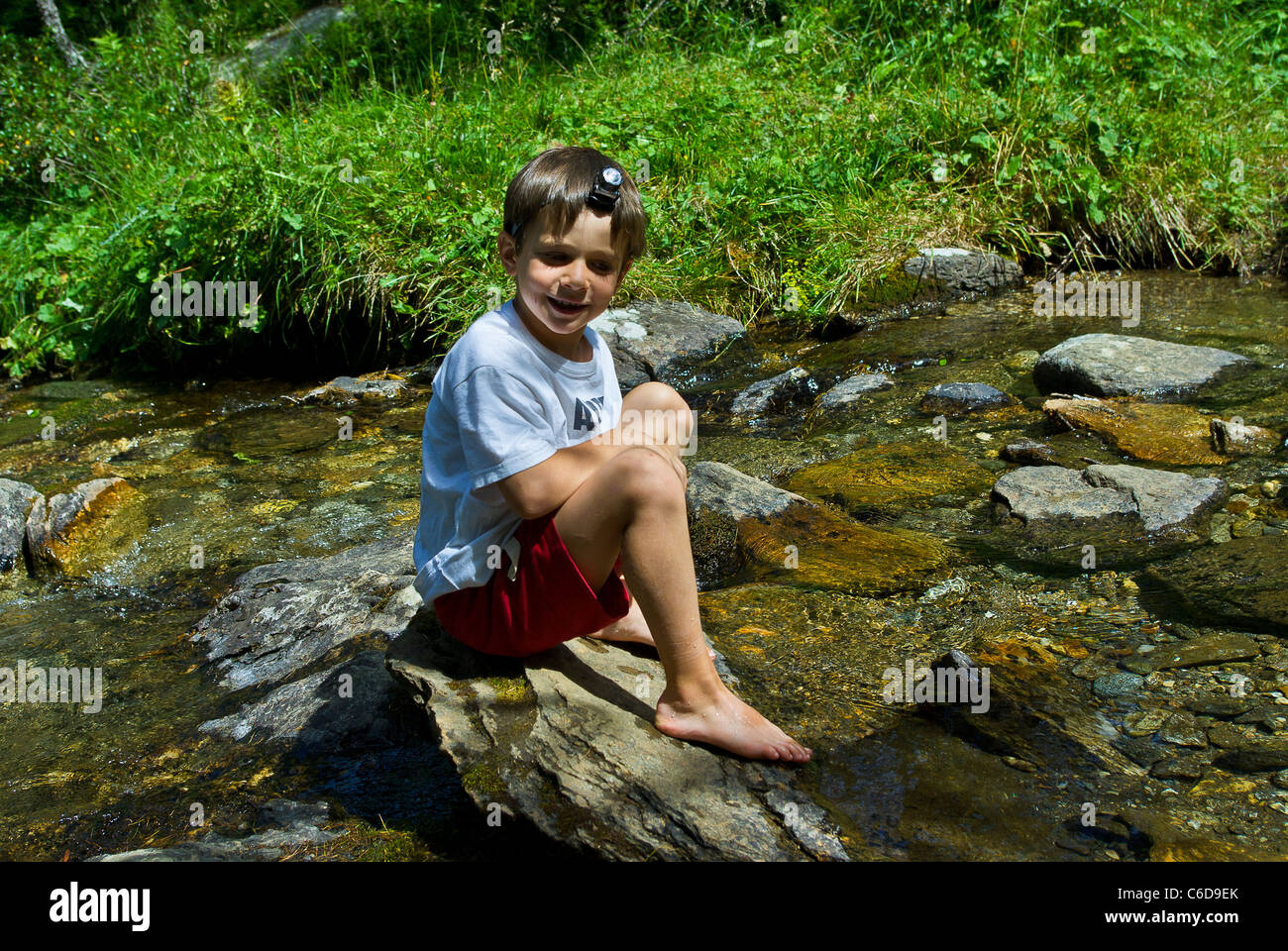 Boy Sitting On Riverbank High Resolution Stock Photography and Images ...