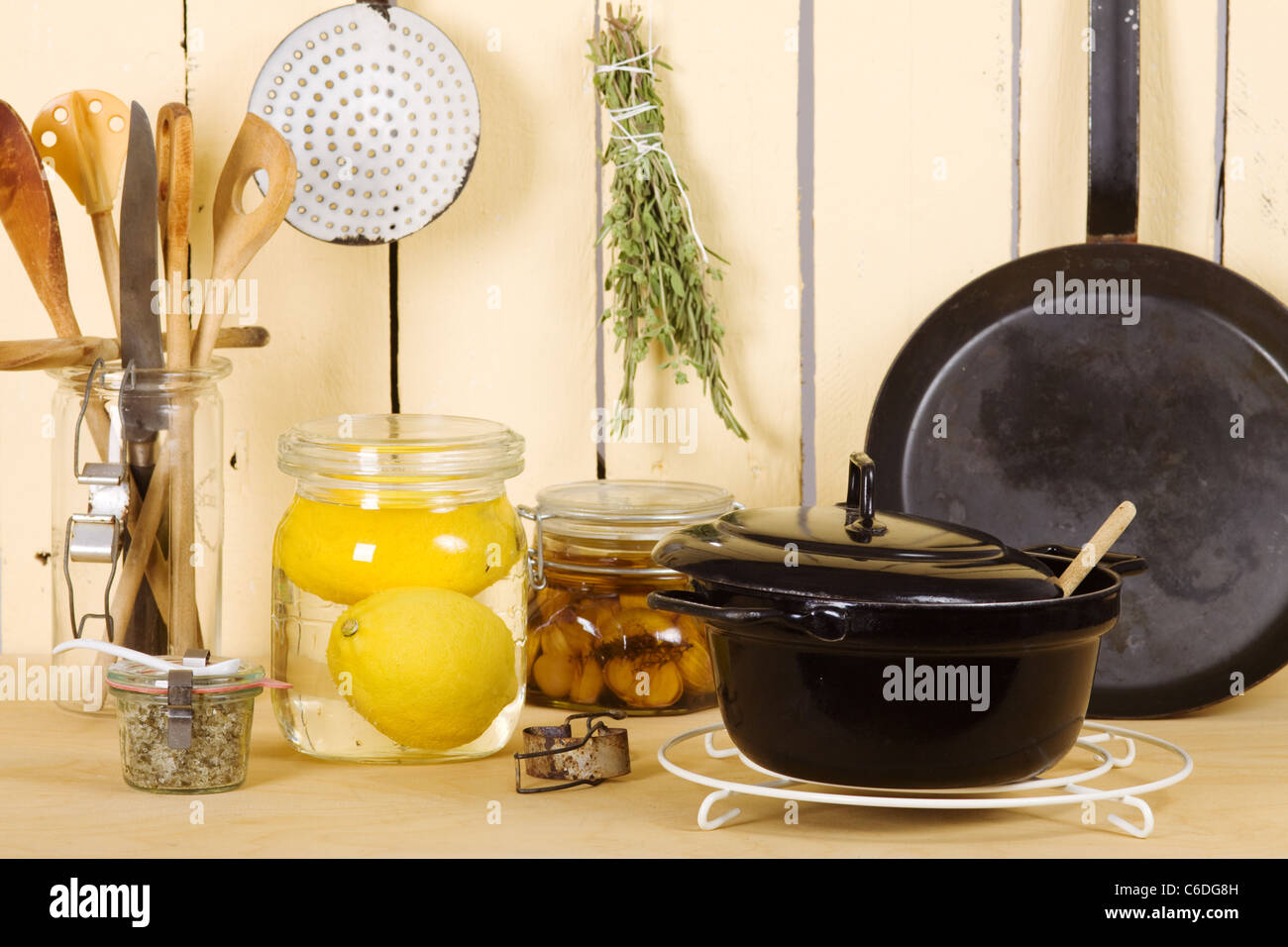 Kitchen utensils put on a kitchen cabinet Stock Photo