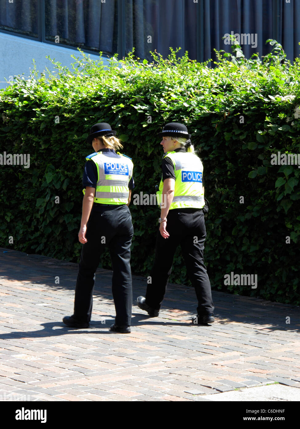 Two police women walking the beat wearing uniform and hi vis vest Sheffield  South Yorkshire England Stock Photo - Alamy