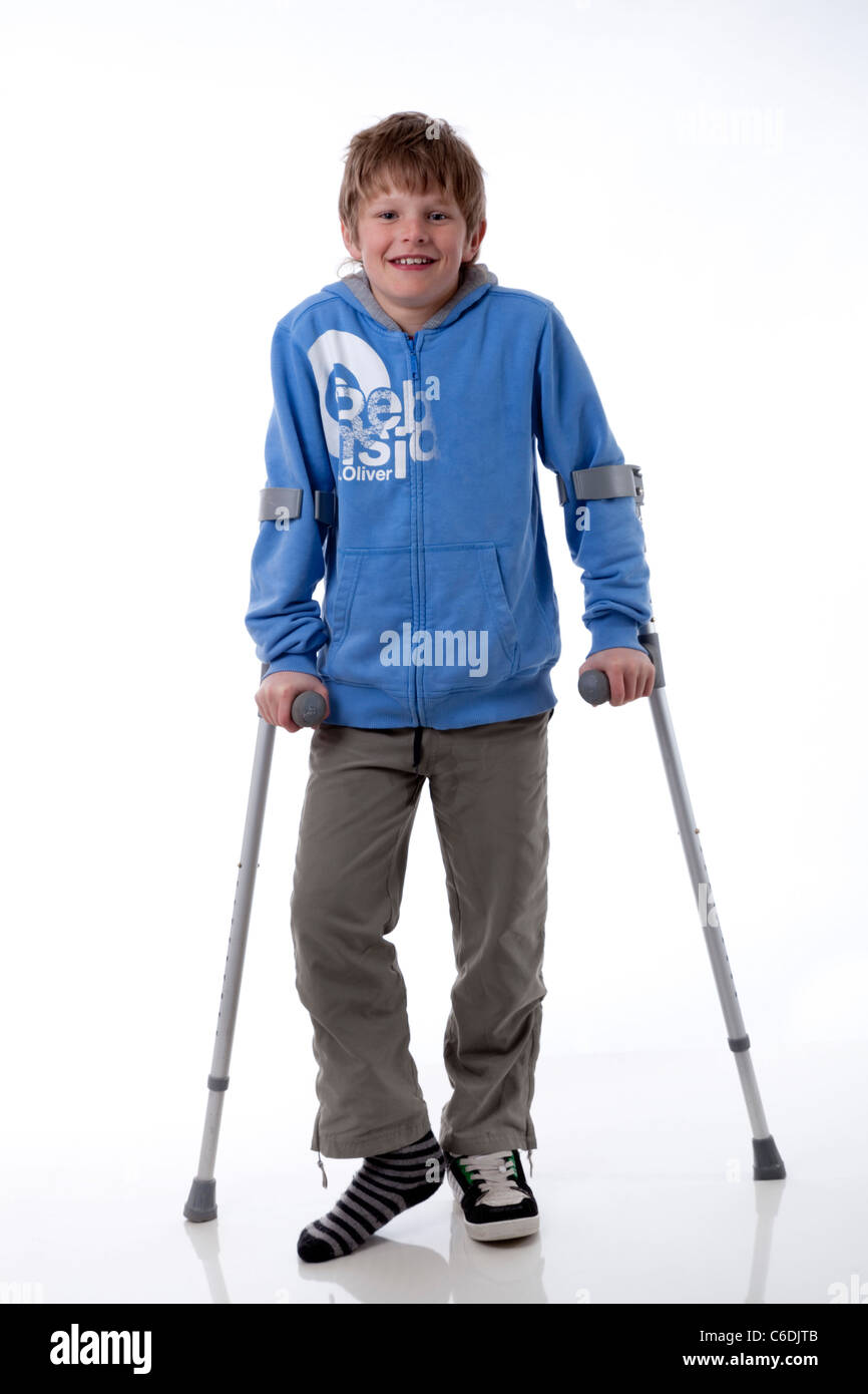 boy with crutches Stock Photo Alamy
