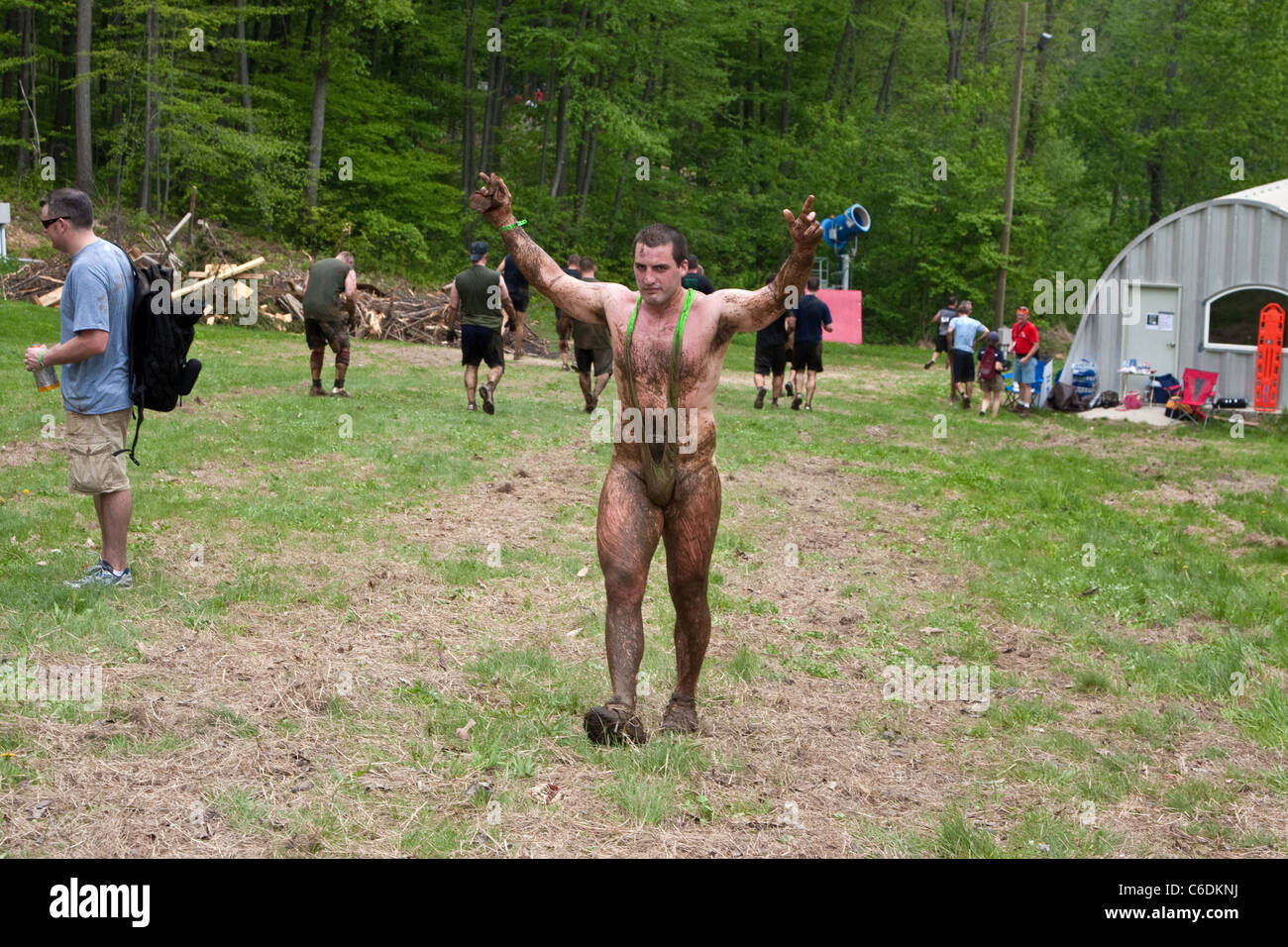 A Tough Mudder participant competes i nthe event wearing only a Borat style 'Mankini'. Tough Mudder is a one day extreme sports Stock Photo