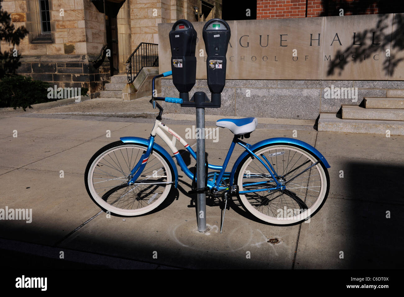 Commuter bike locked to parking meter. New Haven, CT. Stock Photo