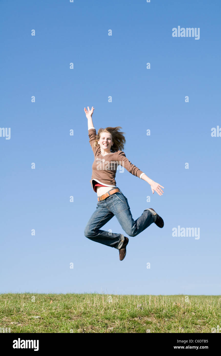 Woman jumping for joy, Jena, Thuringia, Germany Stock Photo