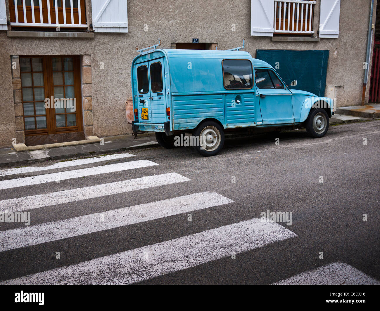 Citroen 2cv van parked by a pedestrian crossing in France Stock Photo