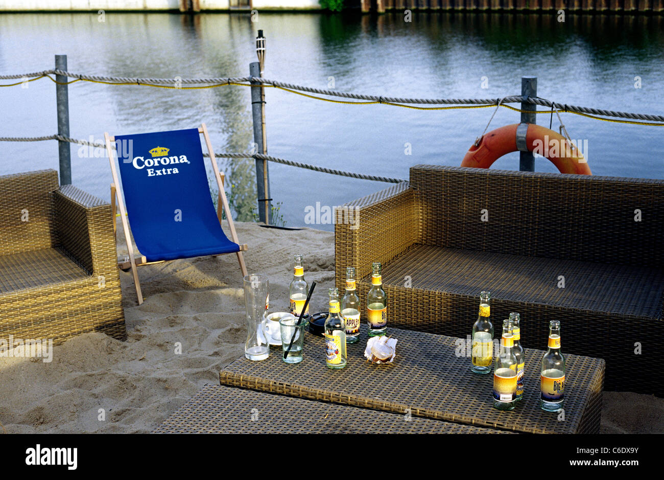 Emptied bottles of Hessian local cider drink (Apfelwein) left behind on a table in King Kamehameha Beach Club in Offenbach. Stock Photo