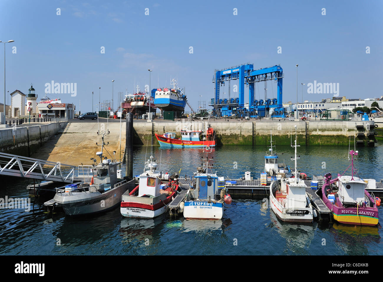 Trawler fishing boats on shipbuilding yard for maintenance works in the Guilvinec port, Brittany, France Stock Photo