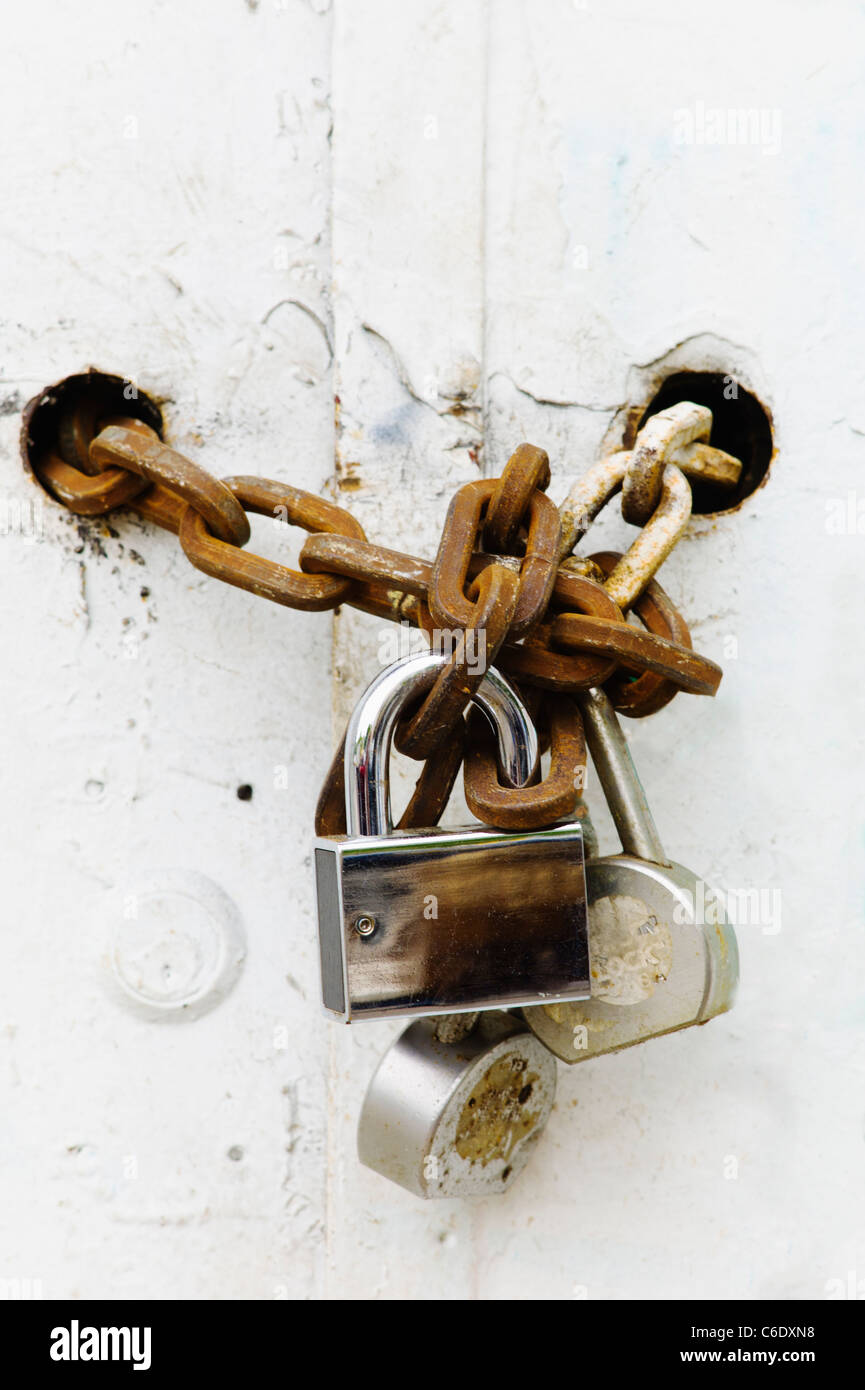 Padlocks and chains on gate Stock Photo Alamy