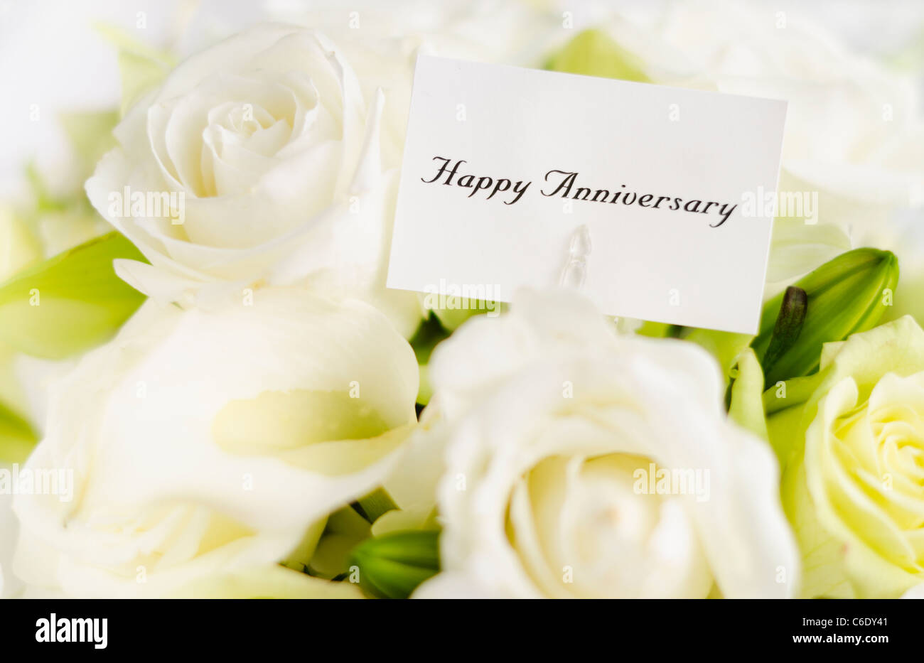  Happy  anniversary  card on bouquet of roses  Stock Photo 