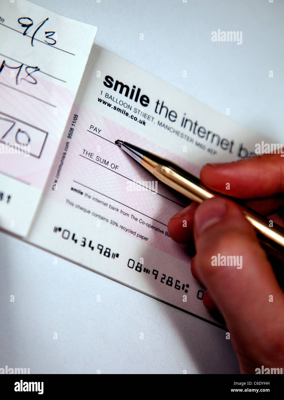 Writing a cheque, London Stock Photo