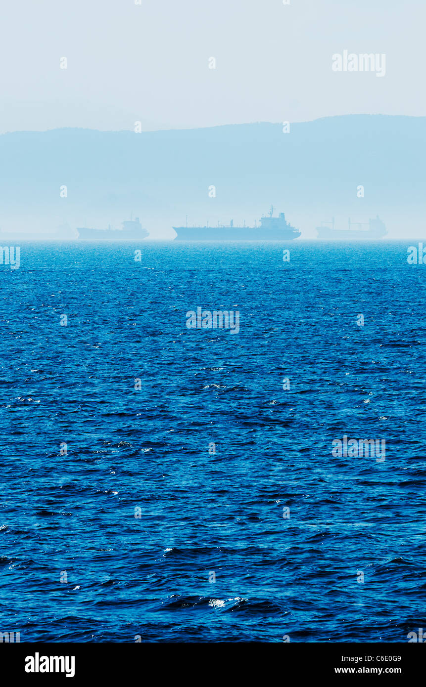 Greece, Oil tankers and cargo ships on Aegean Sea Stock Photo