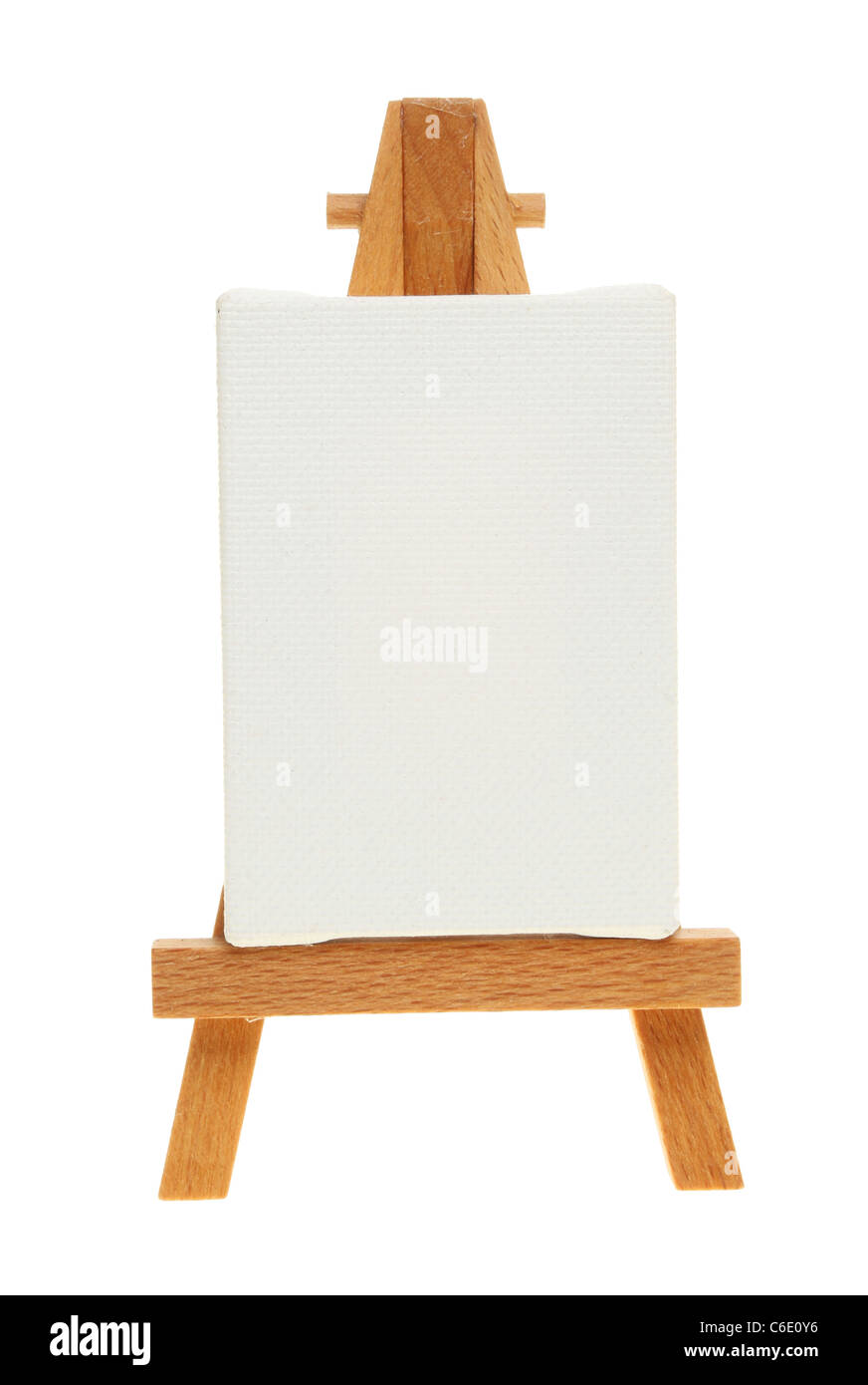 Blank canvas on a wooden easel isolated against white Stock Photo
