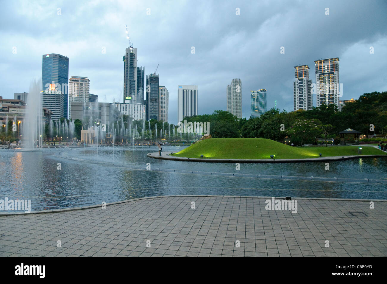 KLCC Park at the Petronas Twin Towers in front of the skyline with office buildings and hotels, Kuala Lumpur, Malaysia, Asia Stock Photo
