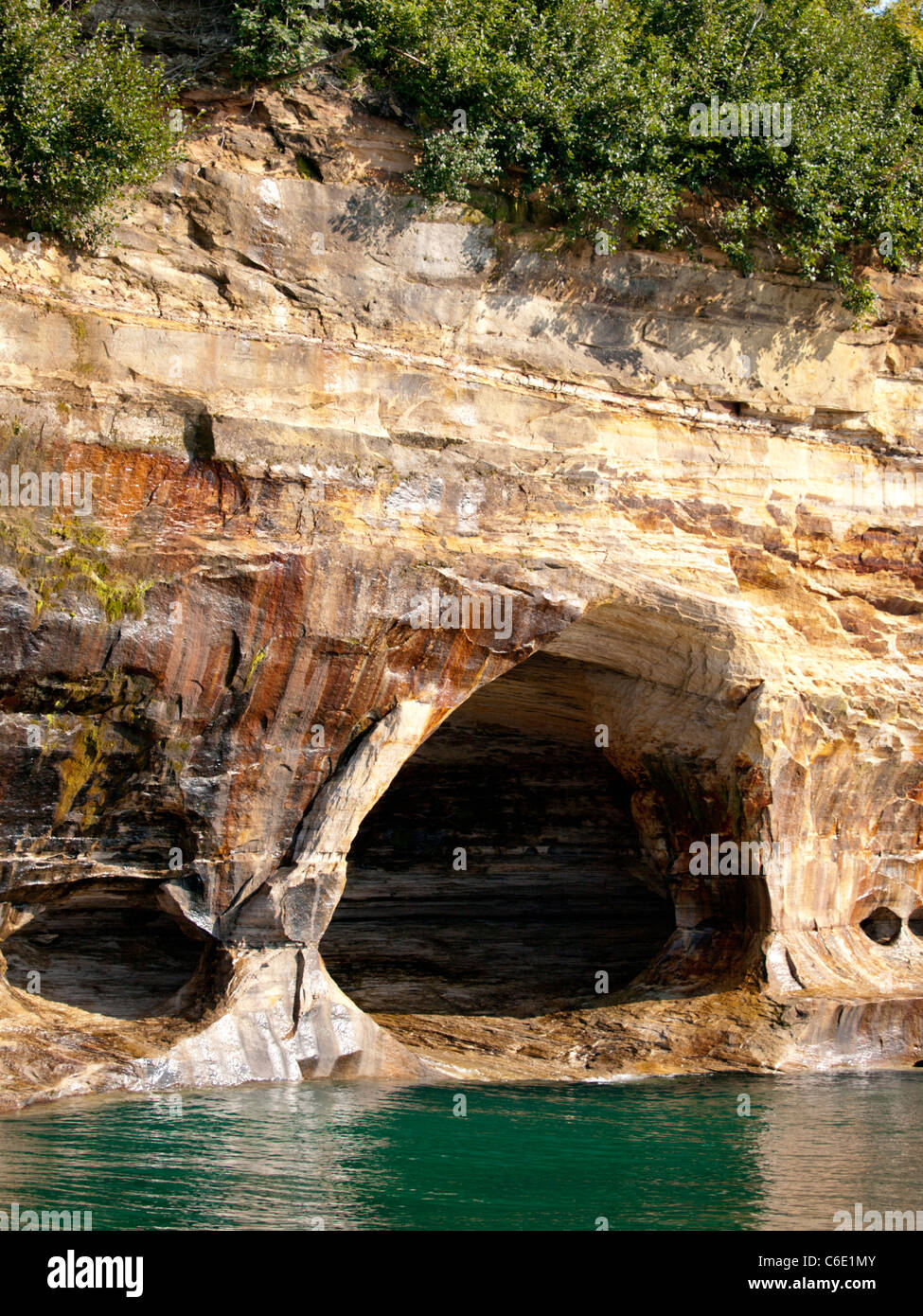 Michigan's Pictured Rocks beautifully colored cliffs has many caves ...