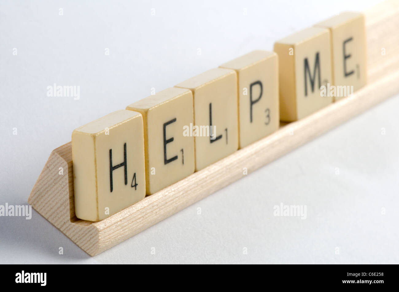 Help spelled with scrabble tiles Stock Photo