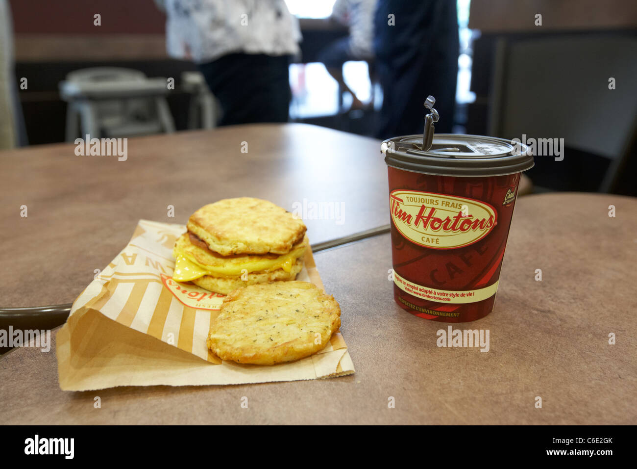 medium coffee and breakfast meal eating out in tim hortons coffee shop canada Stock Photo