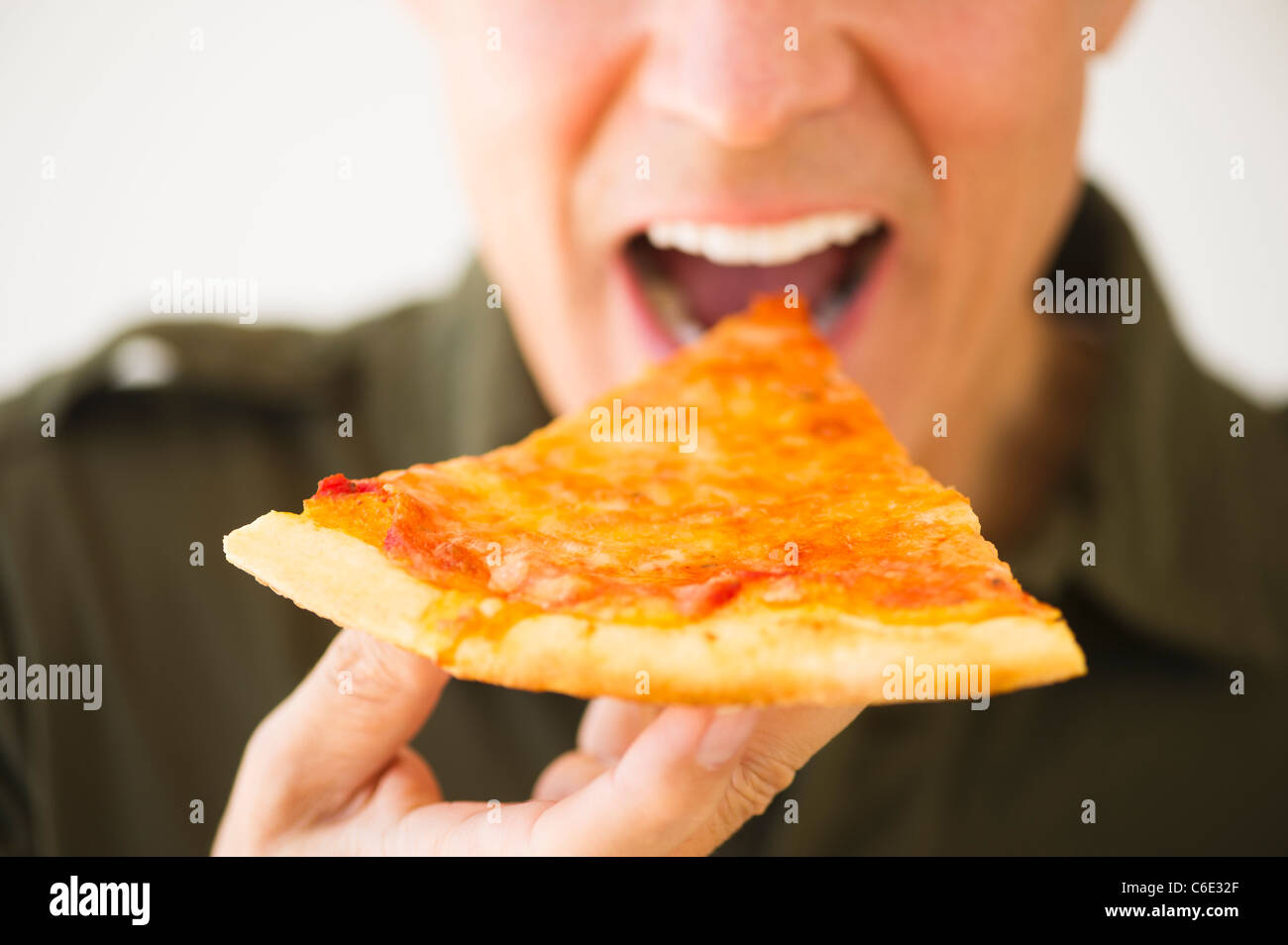 Man eating pizza Stock Photo