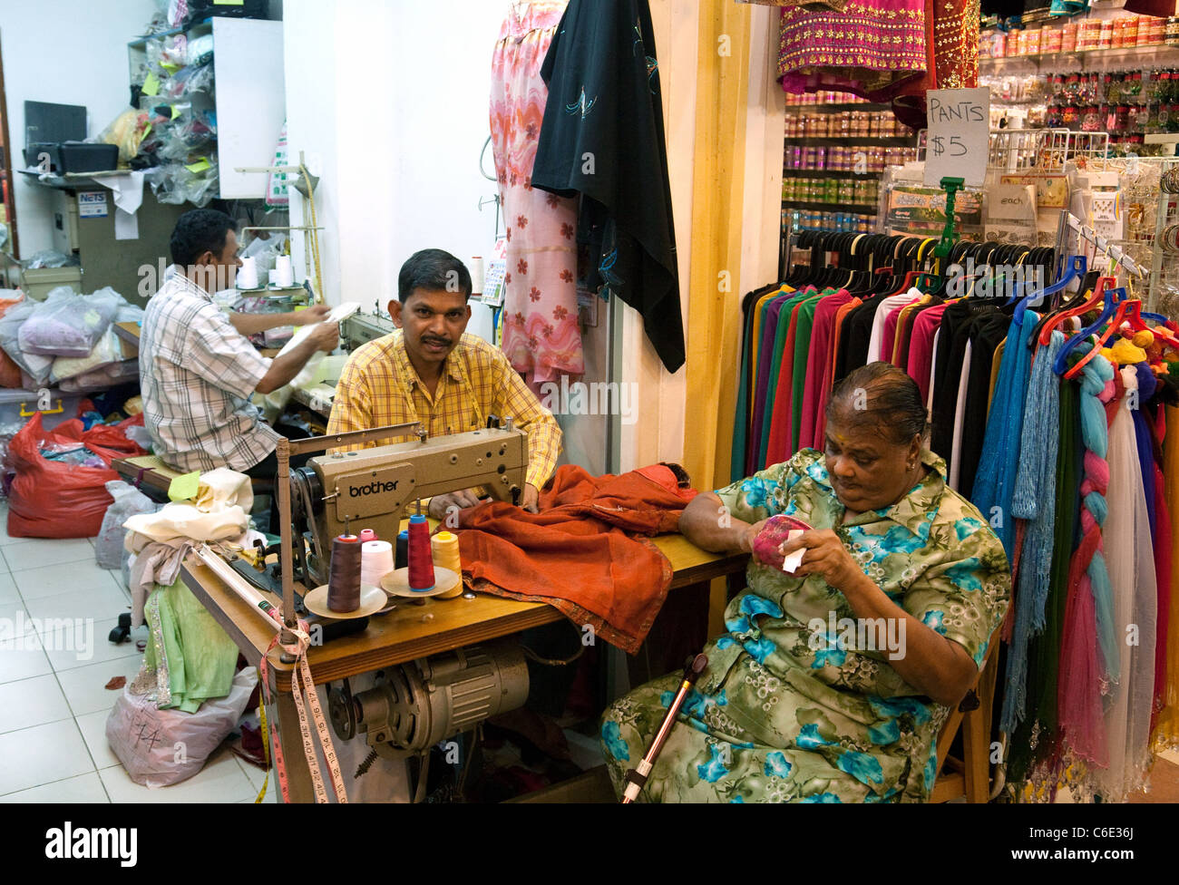 Clothes makers in an Indian clothes shop, the indoor Tekka market, Little India, Singapore Asia Stock Photo