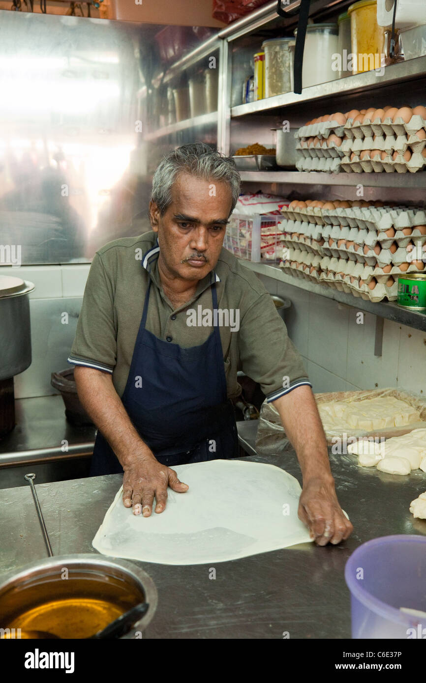 An Indian food hawker stall making prata, at the indoor Tekka market, Little India Singapore Stock Photo