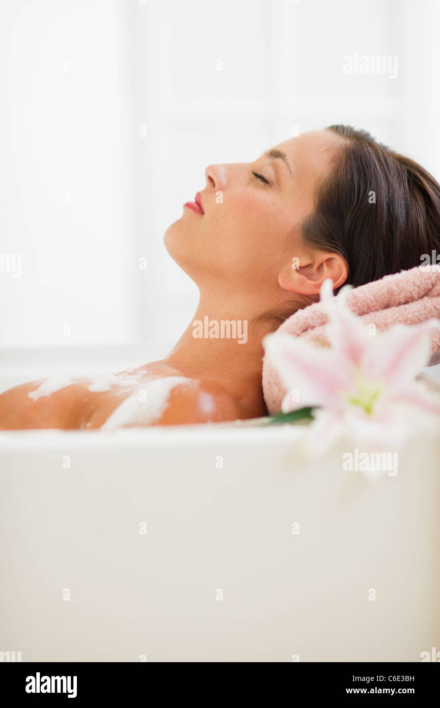 Young woman taking bath Stock Photo