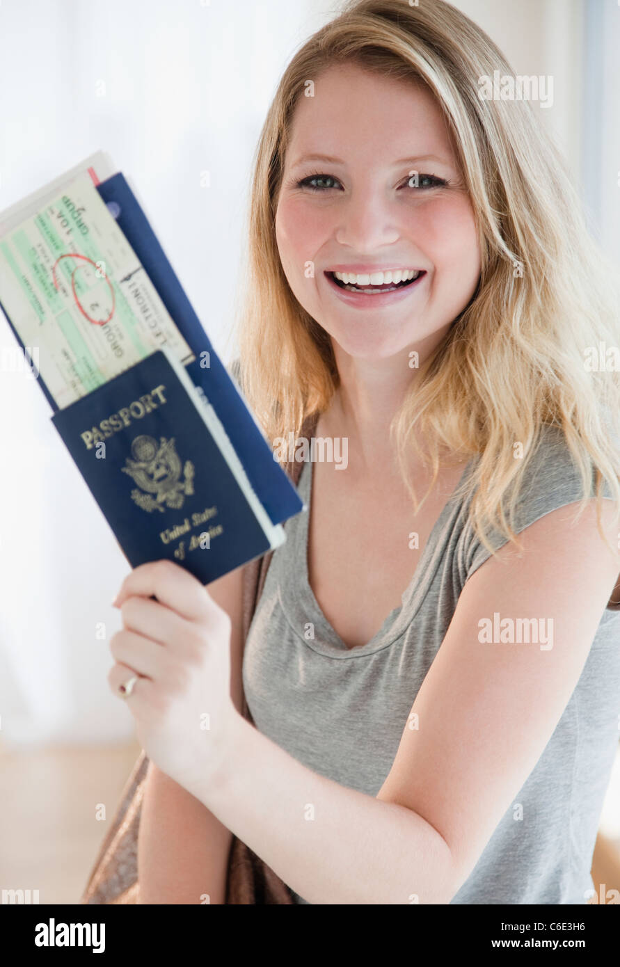 USA, New Jersey, Jersey City, Young woman holding passports and plane  tickets Stock Photo - Alamy