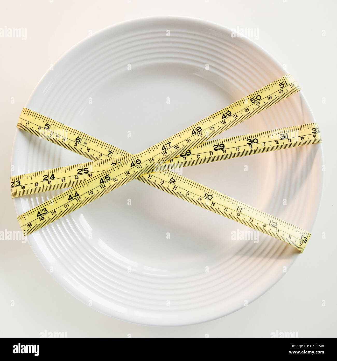 USA, New Jersey, Jersey City, Plate tied with tape measure Stock Photo