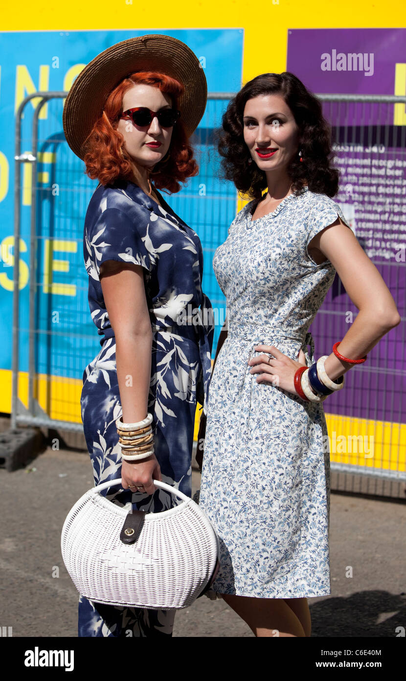 Mid shot portrait of two women wearing vintage clothing, London